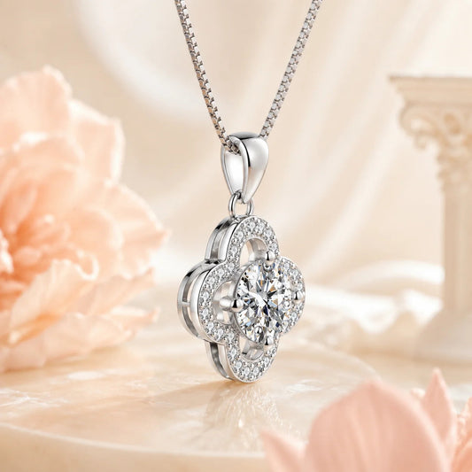 Angled view of Eros' Clover pendant and box chain