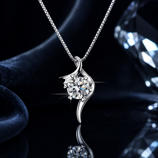 Close-up of Drift S-curve fluid frame moissanite pendant with reflective crystal styling