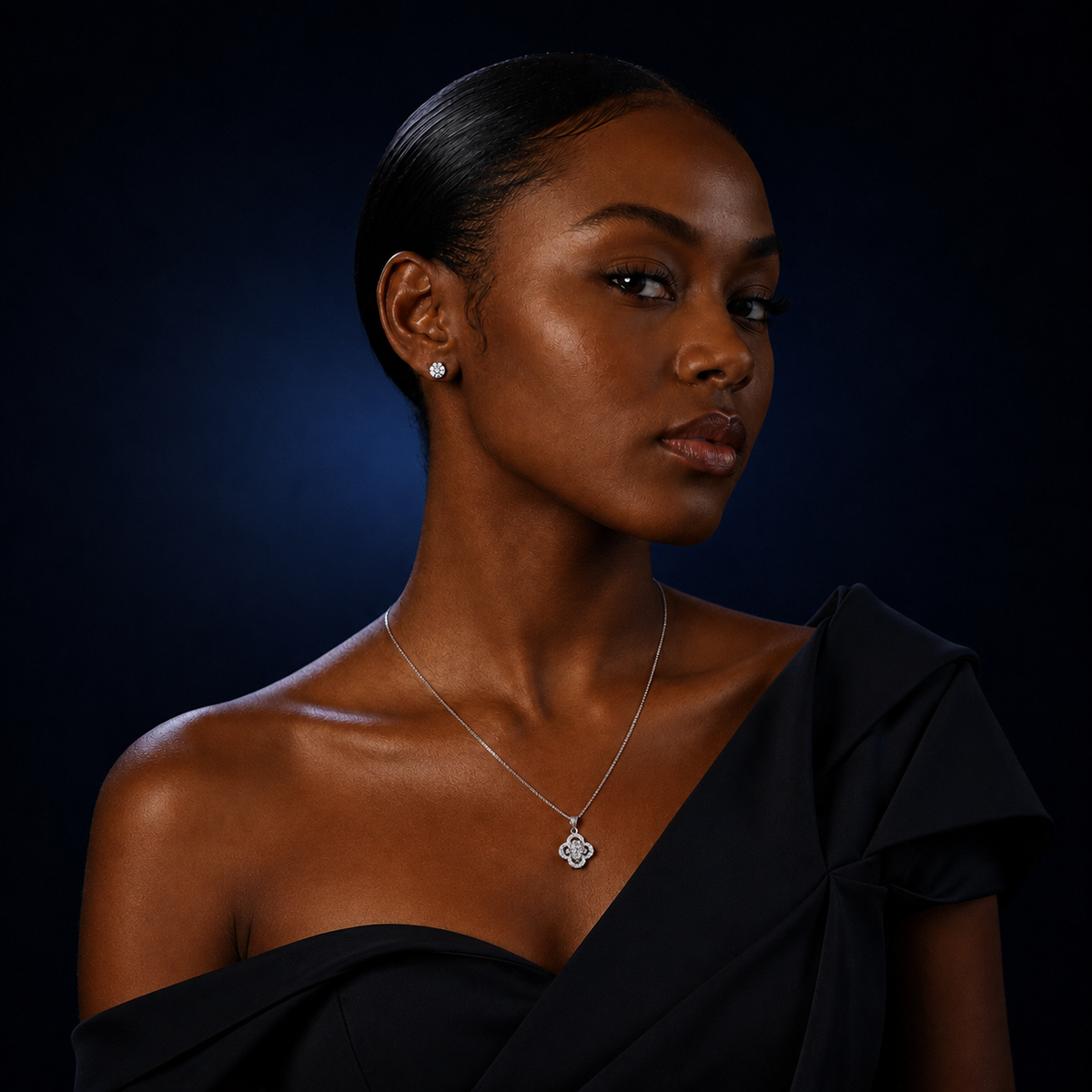 Model wearing Rosette four-petal halo moissanite pendant necklace
