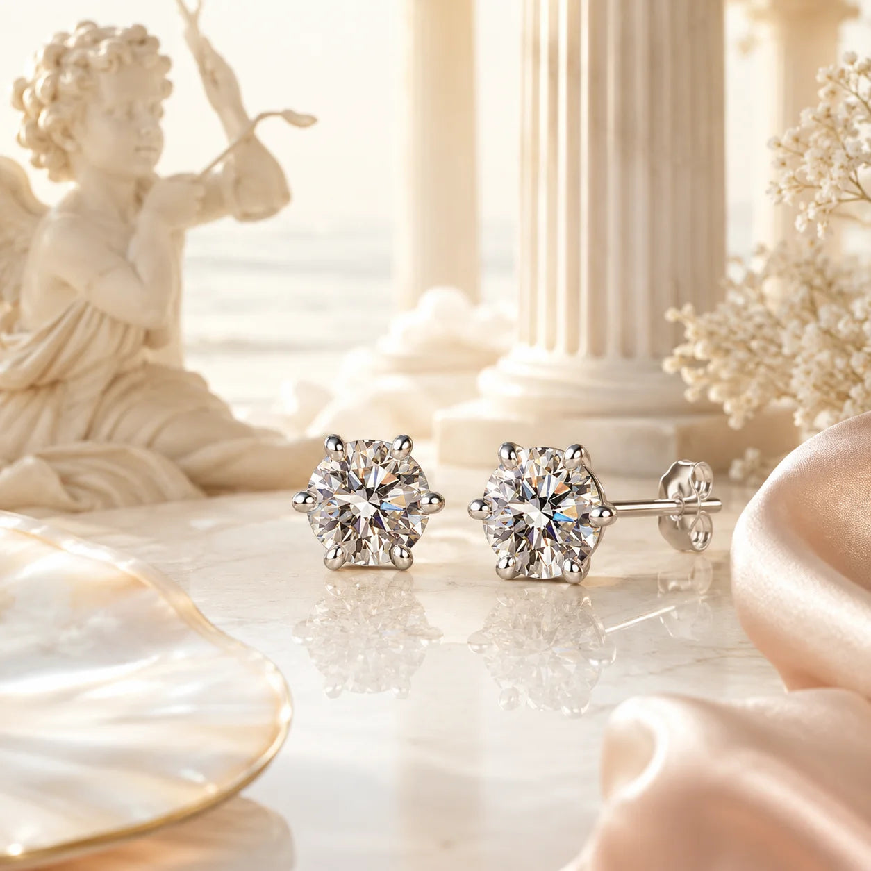 SENTO Eros Lumiere stud earrings lifestyle shot cupid statue column warm luxury background