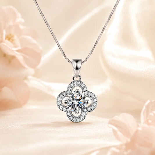 SENTO Eros Clover moissanite pendant necklace front view on silk surface with cupid statue