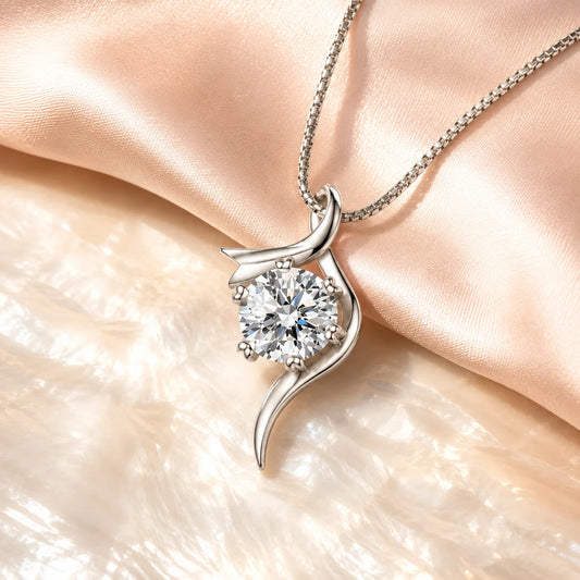 Close view of Eros' Flux pendant against blush silk