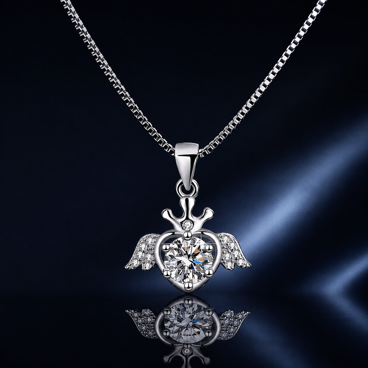 Close-up of Plume winged crown heart moissanite pendant and box chain