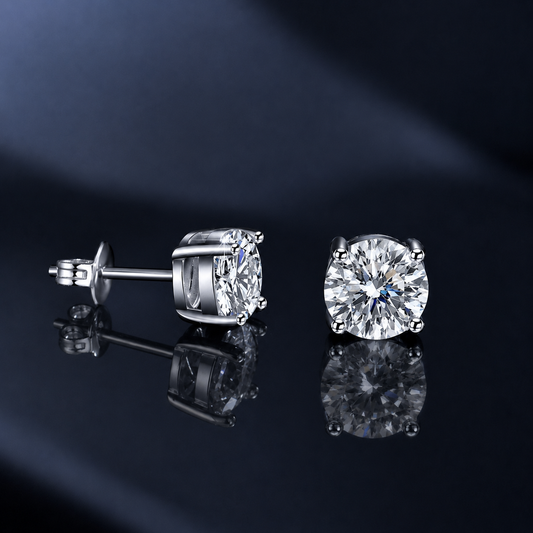 Lucent four-prong round moissanite studs shown from front and side with butterfly back
